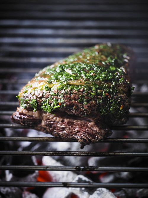 Whole grilled flank steak with wild garlic chimichurri